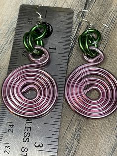 Nothing like these simple Round Pink Circles accented with green, inspired by the sorority AKA to have for days you throw on a pair of jeans or you dress up with a suit. You can't go wrong with them! Aluminum wire jewelry made by me with Love! I create fun handcrafted jewelry from anodized aluminum and sterling silver. Items are ready to ship, made to order and can be custom made to order. * Handmade Please note the picture is zoomed close to show the detail of the item *Items are handcrafted wh Casual Green Dangle Jewelry, Green Dangle Wrap Earrings With Ear Wire, Green Drop Wrap Earrings With Ear Wire, Green Wrap Drop Earrings With Ear Wire, Green Wrap Earrings With Ear Wire For Gift, Green Wrap Earrings As Gift, Casual Green Drop Earrings, Casual Green Nickel-free Jewelry, Casual Green Everyday Earrings