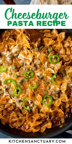 cheeseburger pasta recipe in a skillet with green peppers and onions on top