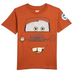 an orange t - shirt with a cartoon character on the front, and green eyes