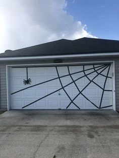 a garage with a spider web design painted on it