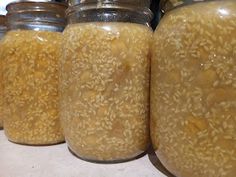 jars filled with rice sitting on top of a counter