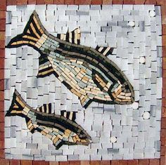 two fish made out of small tiles on a tile background with white and brown squares