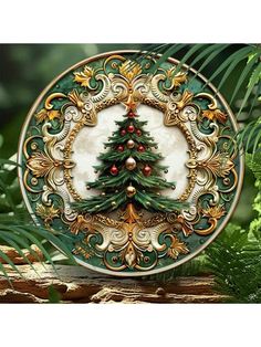 a green and gold christmas ornament with a tree on it