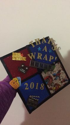 someone is holding up a graduation cap that says, that's a wrap 2018