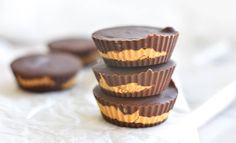 three chocolates stacked on top of each other with peanut butter in the middle,