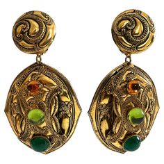 Vintage French clip-on Etruscan style earrings. The gilt metal earrings have a very ornate motif and are adorned by three sizeable colored resin cabochons. French Clip, Jeweled Earrings, Metal Earrings, Style Earrings, Vintage French, French Vintage, Clip On Earrings, Metallica, Jewelry Earrings