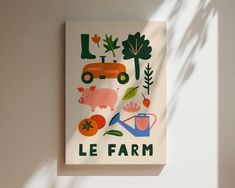 a poster with farm animals and trees on it's side, against a white wall