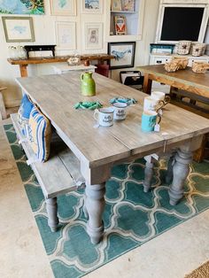 a kitchen table with two benches on top of it