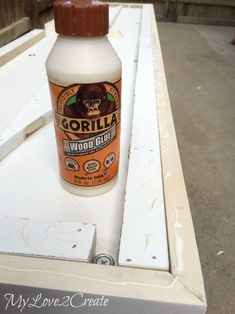 a bottle of gorilla wood glue sitting on top of a table