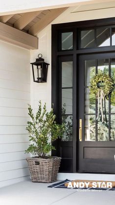 a black front door on a white house