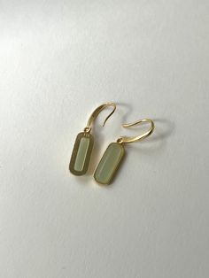 Understated, elegant jade pendant earrings made with a 925 silver base.

Sold as a pair

14K/18K Gold-plated 925 silver, Green Jade

Ready to Gift: Every order is presented in a Gabi Gift Box + Pouch

Measurements. Length 3.1cm. Finger Tattoos Ring, Ringe Aesthetic, Ring Tattoos For Couples, Engagement Rings Aesthetic, Finger Tattoo Couple, Ring Finger Tattoo Couple, Gabi The Label, Box Pouch, Dope Jewelry