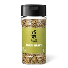 rosemary seasoning in a glass jar on a white background