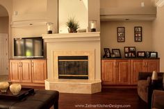 a living room filled with furniture and a flat screen tv mounted on the wall above a fireplace