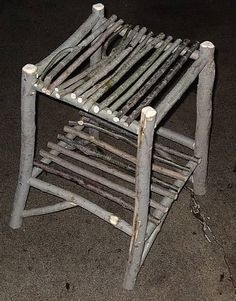 an old wooden chair sitting on the ground