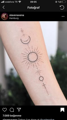 the sun and moon tattoo is shown on someone's left arm, which has been drawn