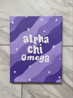 an acrylic sign that says,'alpha chi omega '