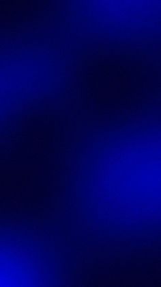 a blurry image of blue lights in the dark