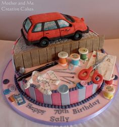 a birthday cake decorated with sewing supplies and a car