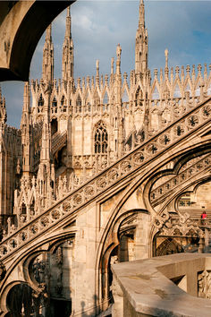 an old building with many spires on it's sides and a staircase leading up to the top