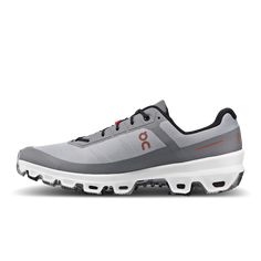 the on cloud running shoe in grey and orange is available for purchase at foot locker