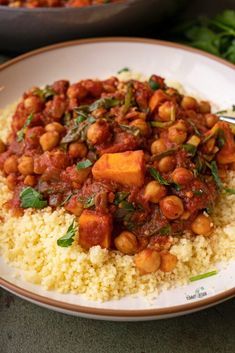 a white plate topped with rice and chickpeas