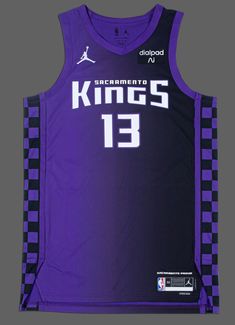 a purple and black basketball jersey with the number 13 on it's chest is shown