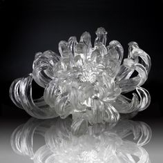 a clear glass object sitting on top of a table