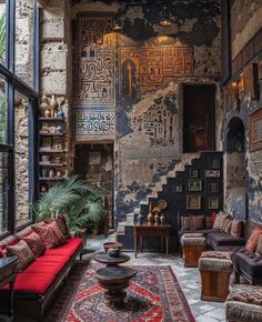 a living room filled with lots of furniture next to a wall covered in arabic writing