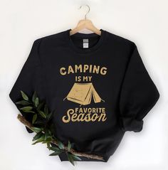 This Camping Crewneck is perfect for the holidays! This cozy crewneck makes the perfect gift for that special get away . Snag it up for a festive look. Disclaimer - Colors in listings may slightly vary depending on what device you are using - Prints may appear smaller depending on the shirt size ordered **MOCKUP IMAGE IS BLACK A unisex heavy blend crewneck sweatshirt that is soft, comfy, and cozy. The collar is ribbed knit, so it retains its shape even after washing. There are no itchy side seam Letter Print Top For Camping In Fall, Crew Neck Winter Tops For Camping, Letter Print Sweatshirt For Fall Camping, Cozy Outdoor Sweatshirt With Letter Print, Fall Camping T-shirt With Letter Print, Crew Neck Sweatshirt For Fall Camping, Fall Crew Neck Sweatshirt For Camping, Fall Adventure T-shirt With Letter Print, Camping Sweatshirt Ideas