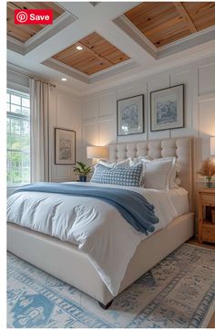 a large white bed sitting in a bedroom next to two windows