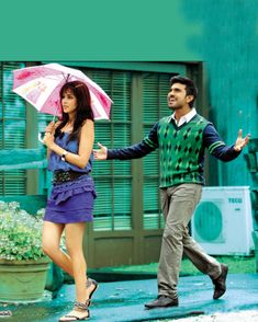 a man and woman walking in the rain with an umbrella