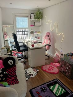 a living room with hello kitty rugs on the floor and other furniture in it