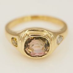 Neptune collection is finally here! This is a beautiful statement signet ring, set with a very special natural watermelon green & pink oval tourmaline in the center, natural color diamond on each side, handmade in 18k yellow gold. Details: -One of a Kind -18k yellow gold -natural watermelon green & pink oval tourmaline approx. 2.06ct -natural color diamonds approx. 0.40ct -handmade in NYC Heirloom Oval Tourmaline Ring, Oval Tourmaline Ring With Center Stone, Diamond Signet Ring, Gold Details, Signet Ring, Ring Set, Natural Color, Colored Diamonds, Tourmaline