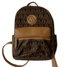 Brown Tan Leather Backpack M Monogram Medium Sized 13 Inches Fits Ipad! Very Roomy New But Has 2 Scratches On Bottom 2 Side Pockets Inside Is Cheetah Print 1 Front Pocket With Zipper And One Big Pocket Great For School Or Day Vacation Trips Fast Shipping Free Gift Bundle 2+ Items For 15% Off Brown Monogram Print Bag For Daily Use, Casual Brown Bag With Logo, Brown Logo Backpack For Travel, Brown Backpack With Logo For Everyday Use, Everyday Brown Backpack With Logo, Disneyland Backpack, Bohemian Backpack, Sequin Backpack, M Monogram