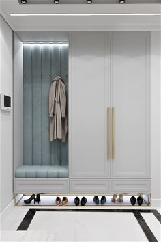 a closet with several pairs of shoes on the floor and coat rack in front of it