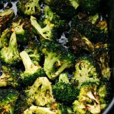 broccoli florets are being cooked in a pan