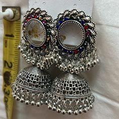 Jhumka Earings In Silver Gray And Multi Colors, Blue Or Black. New, Great To Pair With Any Jeans And Top, Can Be Worn With Any Indian Pakistani Shalwar, Kameez, Saree Or Kurta, Charnya Choli. They Are Medium Weight, Recommend To Put Extra Support In Back Like Wearing Rubber Backs Would Help Them Hold It Better. As Is Please Look At All Pictures For Measurements. Costume Fashion Jewelry. Also Have In Silver With Royal Blue Stones, And Black Stones Shown In Last Picture. Please Specify The Color Y Jeans And Top, Pakistani Shalwar, Costume Fashion, Black Stones, Blue Stones, Jhumka Earrings, Shalwar Kameez, Black Stone, Blue Stone