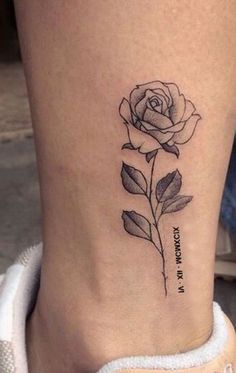 a small rose tattoo on the ankle