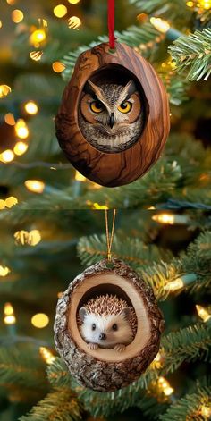 an owl ornament hanging from a christmas tree with its eyes open and the inside of it's hollow