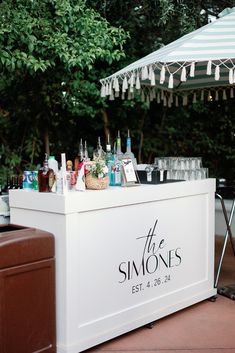 an outdoor bar with drinks on it