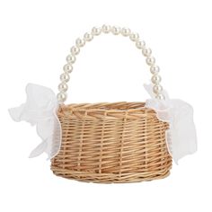 a wicker basket with pearls on the handle and ribbon around the handle, isolated against a white background