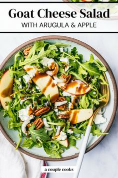 goat cheese salad with arugula and apple in a bowl on a white table