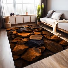 a living room area with a couch, window and rug that has rocks on it