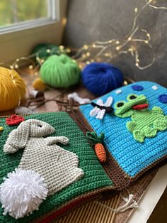 several knitted items are sitting on a table