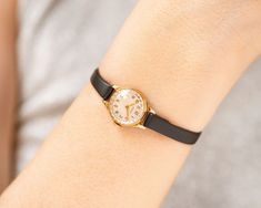 Tiny Women Watch Gold Plated Round Volga Vintage Women Wrist - Etsy Lithuania Everyday Vintage Jewelry With Leather Strap, Vintage Leather Strap Jewelry For Everyday, Vintage Everyday Watches, Everyday Vintage Watch, Adjustable Gold Watches For Evening, Adjustable Gold Evening Watch, Gold Adjustable Evening Watch, Elegant Adjustable Watch With Round Dial, Adjustable Watches With Round Dial For Formal Occasions