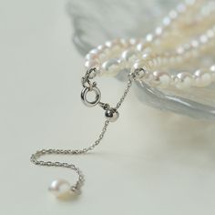 Product Information: Plating: White Gold Material: Freshwater Pearls (5-5.5mm) Size: Necklace Length 37-44 cm Weight: 28.5g Description: Elevate your style with our "Pulldown Double-Layer Beaded Pearl Necklace." This exquisite necklace features high-quality freshwater pearls, each measuring 5-5.5mm, and is elegantly plated with white gold. With an adjustable necklace length of 37-44 cm, it provides versatility in styling and ensures a perfect fit for any occasion. The double-layer design with de Double Strand Pearl Beaded Necklace With Pendant, Multi-strand Pearl White Necklace With Pearl Pendant, Formal Beaded Necklaces With Pearl Chain, Elegant Adjustable Beaded Necklaces, Elegant Adjustable Beaded Necklace, Elegant Double Strand Adjustable Necklaces, Elegant Double Strand Adjustable Necklace, Elegant Adjustable Double Strand Necklaces, Elegant Adjustable Double Strand Necklace