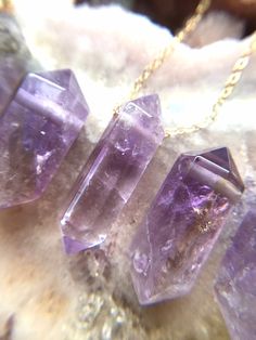 "Handcrafted Amethyst Point Pendant Necklace *Beautiful February Birthstone jewelry gift *Stones are said to have healing abilities *High quality genuine crystals *Raw stones offer stunning unique characteristics *Your choice of chain -- sterling silver or 14k gold *Choose the length you'd like -- 16, 18, or 20\" *Delivered in a luxurious pink velvet jewelry bag Stones vary 15-22mm chunky Move freely on the chain Made to order UNIQUELY YOURS Your necklace will be made to order and will look simi Healing Abilities, February Birthstone Jewelry, Rainbow Moonstone Jewelry, Raw Crystal Necklace, Necklace Purple, Chakra Necklace, Amethyst Point, Velvet Jewelry, Healing Necklace