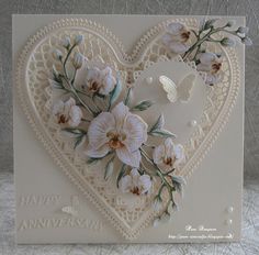 a heart shaped card with flowers on it