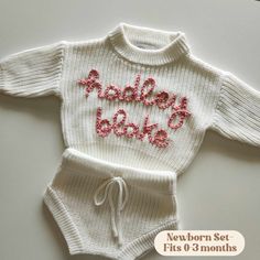 Additional colors can be found in the "INFANT" section. MARSHMALLOW- Custom Name Hand Embroidered Sweater Sets for Newborns- Includes a 0-3 months knit sweater and bloomer shorts. These knits are made of 100% cotton and are the perfect way to introduce your precious baby to the world! We also have the plain option, which is perfect to throw on for any occasion.  Shop the booties and toboggan for the full set.  MATERIALS: Our hand embroidered sweater sets are one-of-a-kind.  These sweater sets ar Fitted White Cotton Diaper Cover, Fitted White Diaper Cover For First Birthday, White Fitted Diaper Cover For Playtime, Birth Announcement Outfit, Announcement Outfit, Sweater Sets, Sweater Shorts, Bloomer Shorts, Personalized Sweater