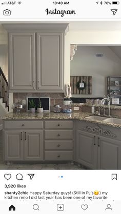 an instagram photo of a kitchen with gray cabinets